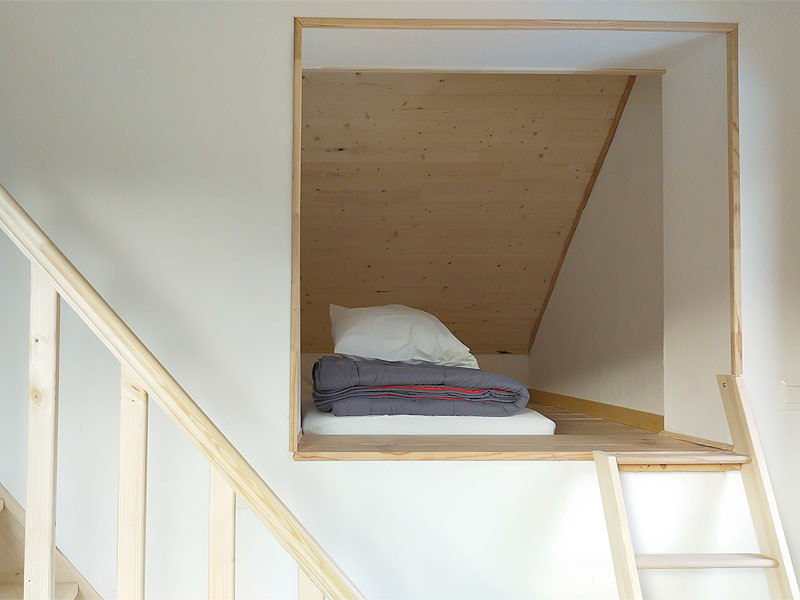 Coin couchage alcove - © Camping Les 7 Laux Coin couchage alcove